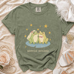 Olive green t-shirt with bride and groom frogs and "Hoppily Hitched" text.