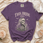 Purple t-shirt with "THIS BRIDE Bites" graphic of a skeleton bride and roses.