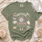 Green t-shirt with "Mother of the Groom" text and spooky-themed graphics.