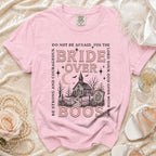 Pink t-shirt with "Bride Over Boos" graphic, a church, and spooky elements.