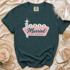 Teal t-shirt with "Just Married Las Vegas" graphic in retro neon style.