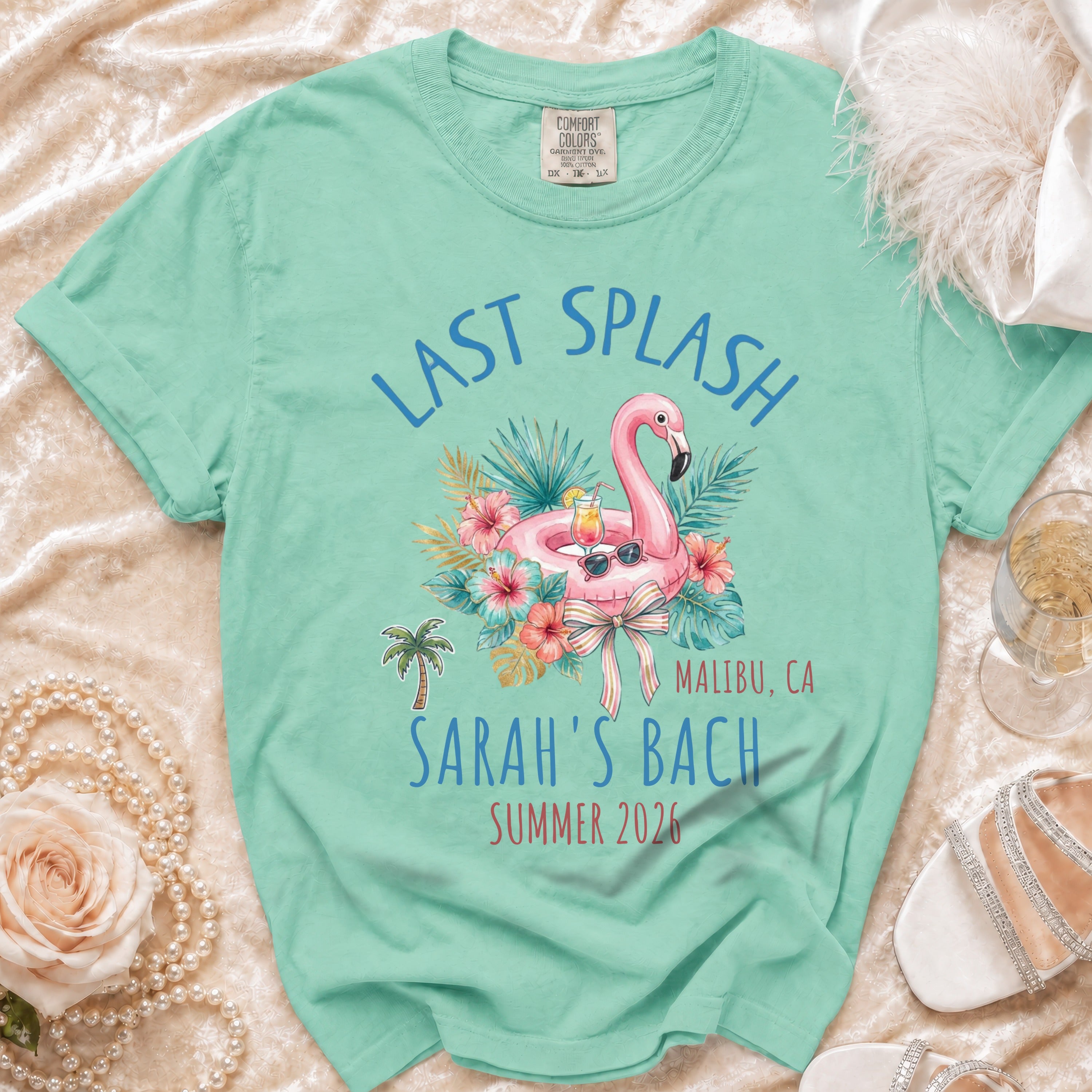 Last Splash Sarah's Bach t-shirt with flamingo and tropical leaves.