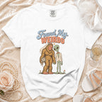 White t-shirt with Bigfoot and alien bride and groom graphic, text reads "Found My Weirdo".