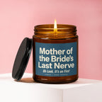Amber glass candle with lit wick, "Mother of the Bride's Last Nerve" text.