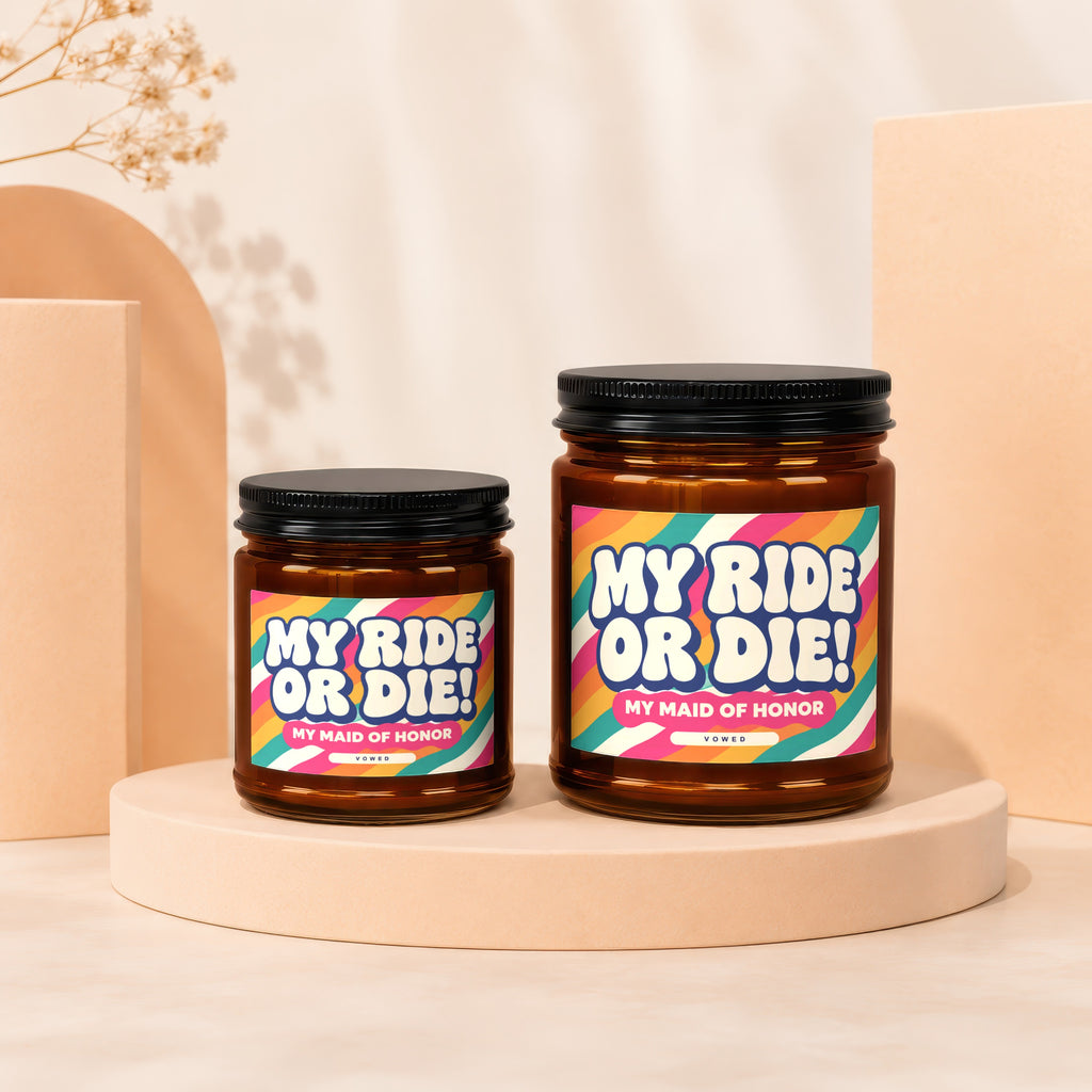 Two candles labeled "MY RIDE OR DIE! MY MAID OF HONOR" on display stands.