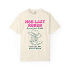 Cream t-shirt with "Her Last Rodeo Jennifer's Bach" and cowboy boots.