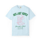 Light blue t-shirt with pink "HER LAST RODEO" text, cowboy boots, and hat.