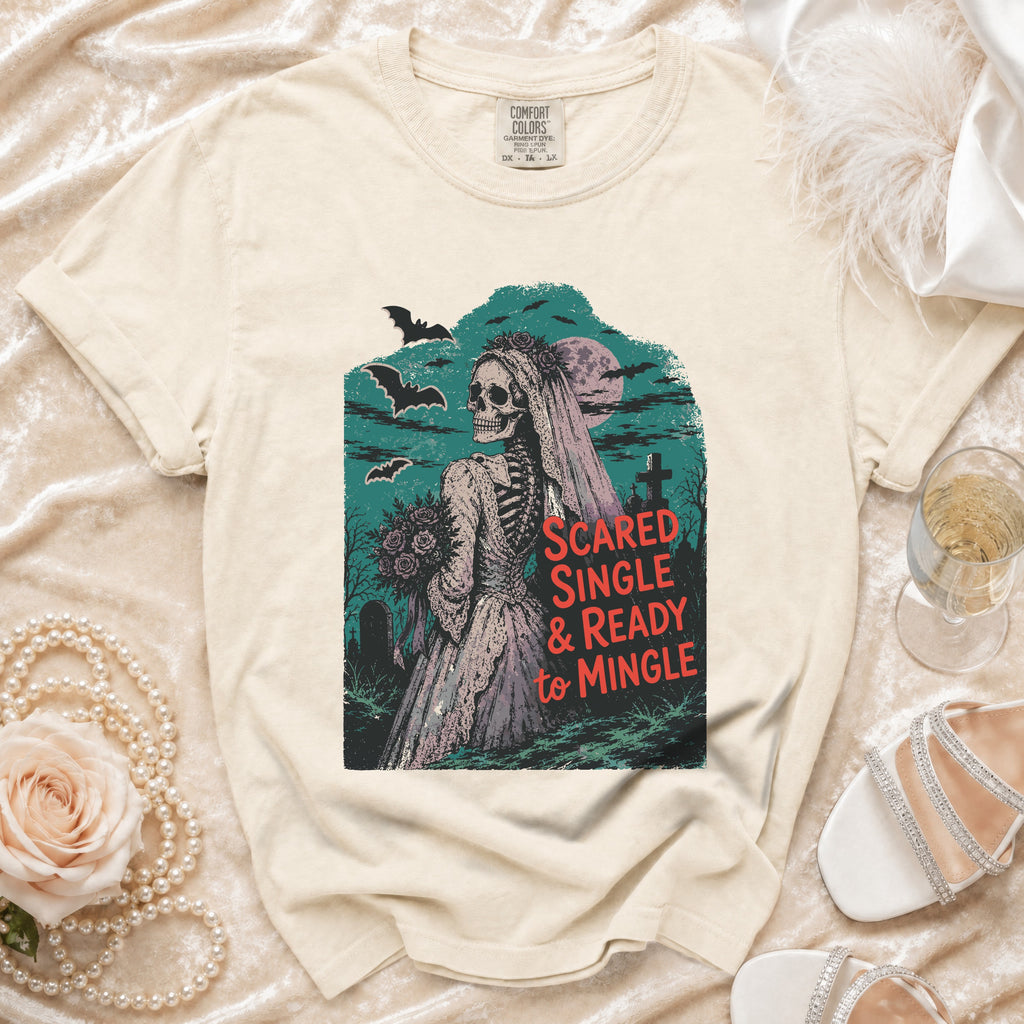 Skeleton bride graphic on cream t-shirt reads "Scared Single & Ready to Mingle".