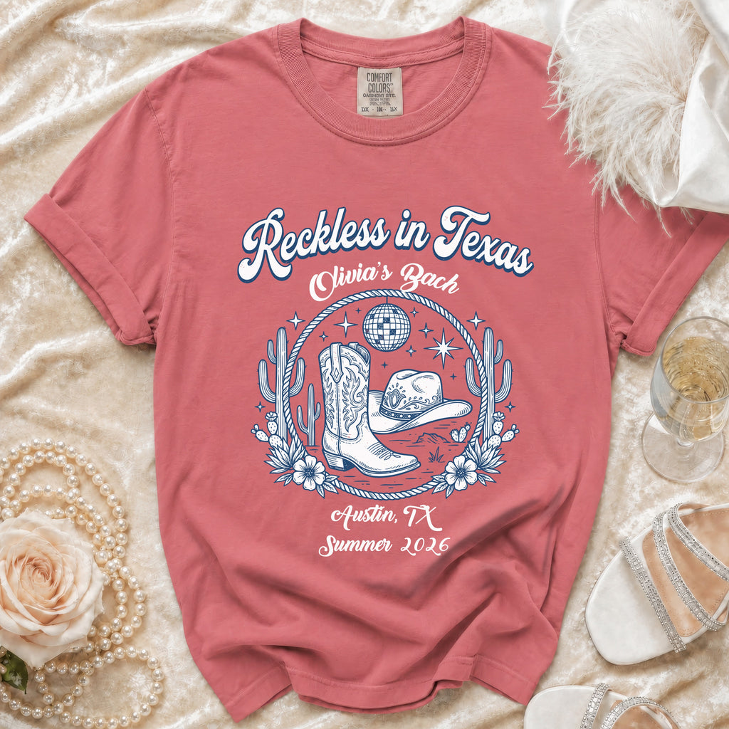 T-shirt with cowboy boots, hat, disco ball, and "Reckless in Texas Olivia's Bach Austin, TX Summer 2026".