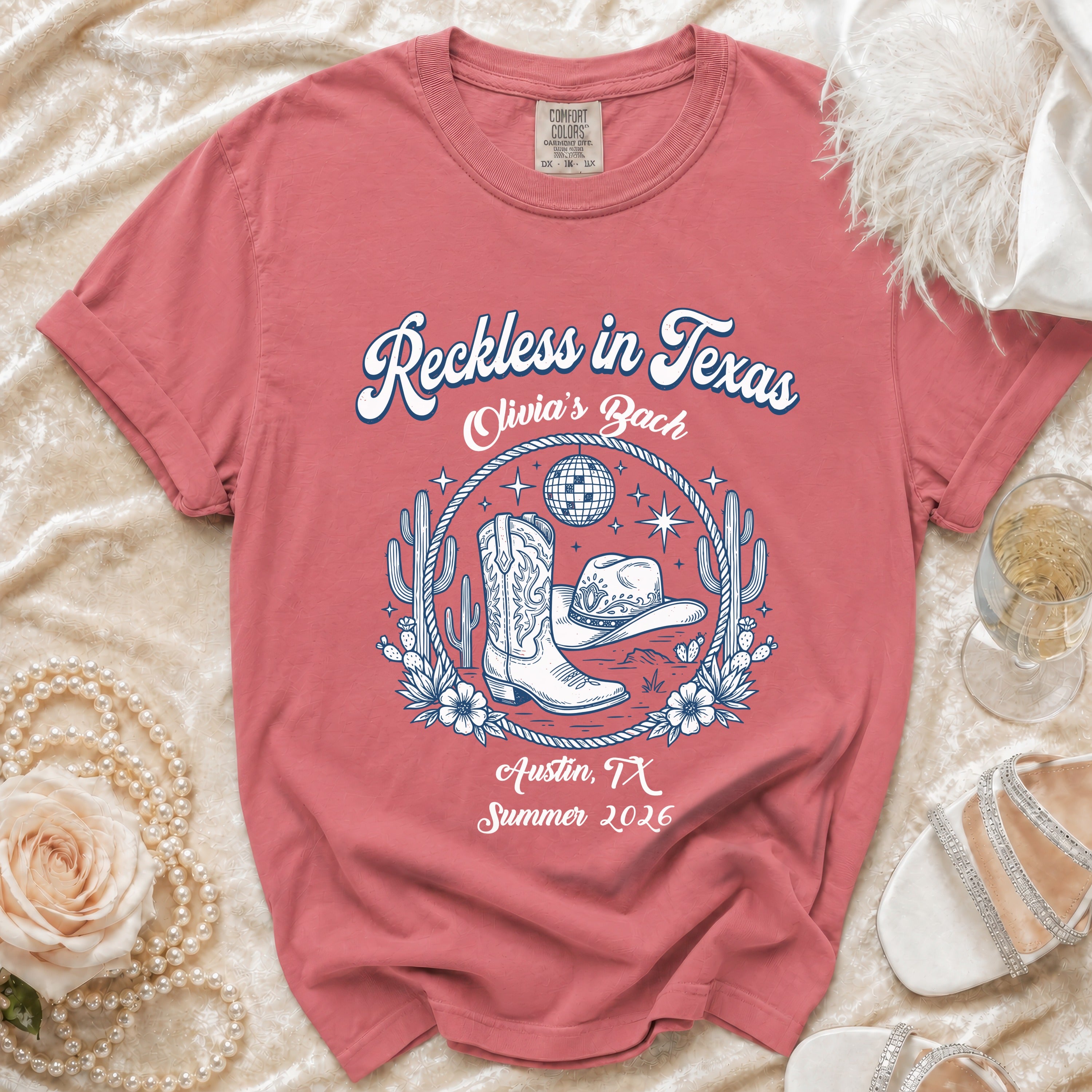 T-shirt with cowboy boots, hat, disco ball, and "Reckless in Texas Olivia's Bach Austin, TX Summer 2026".