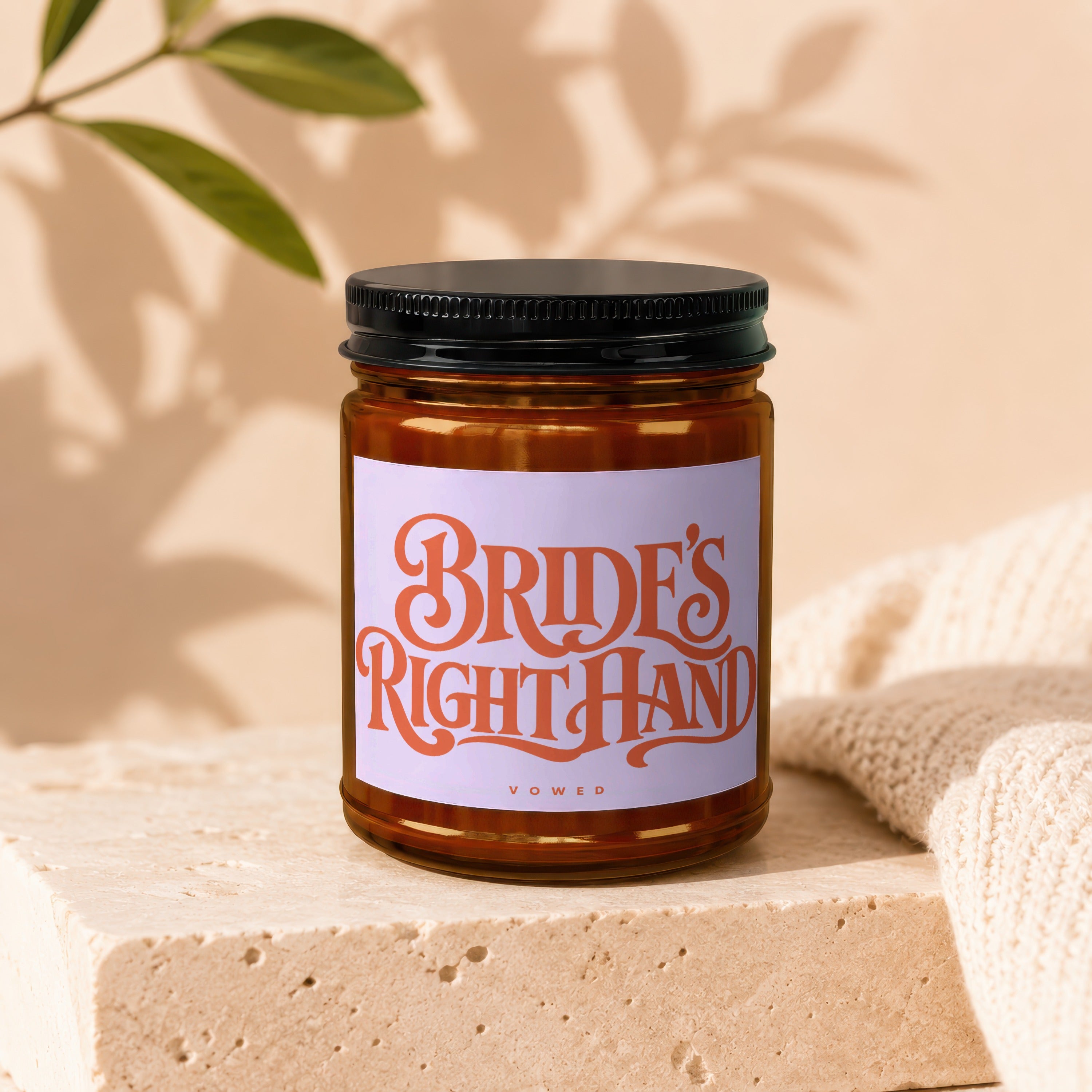 Amber glass candle labeled "BRIDE'S RIGHT HAND" by VOWED.