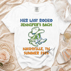 White t-shirt with "Her Last Rodeo Jennifer's Bach Nashville, TN Summer 2026" and cowboy boots.