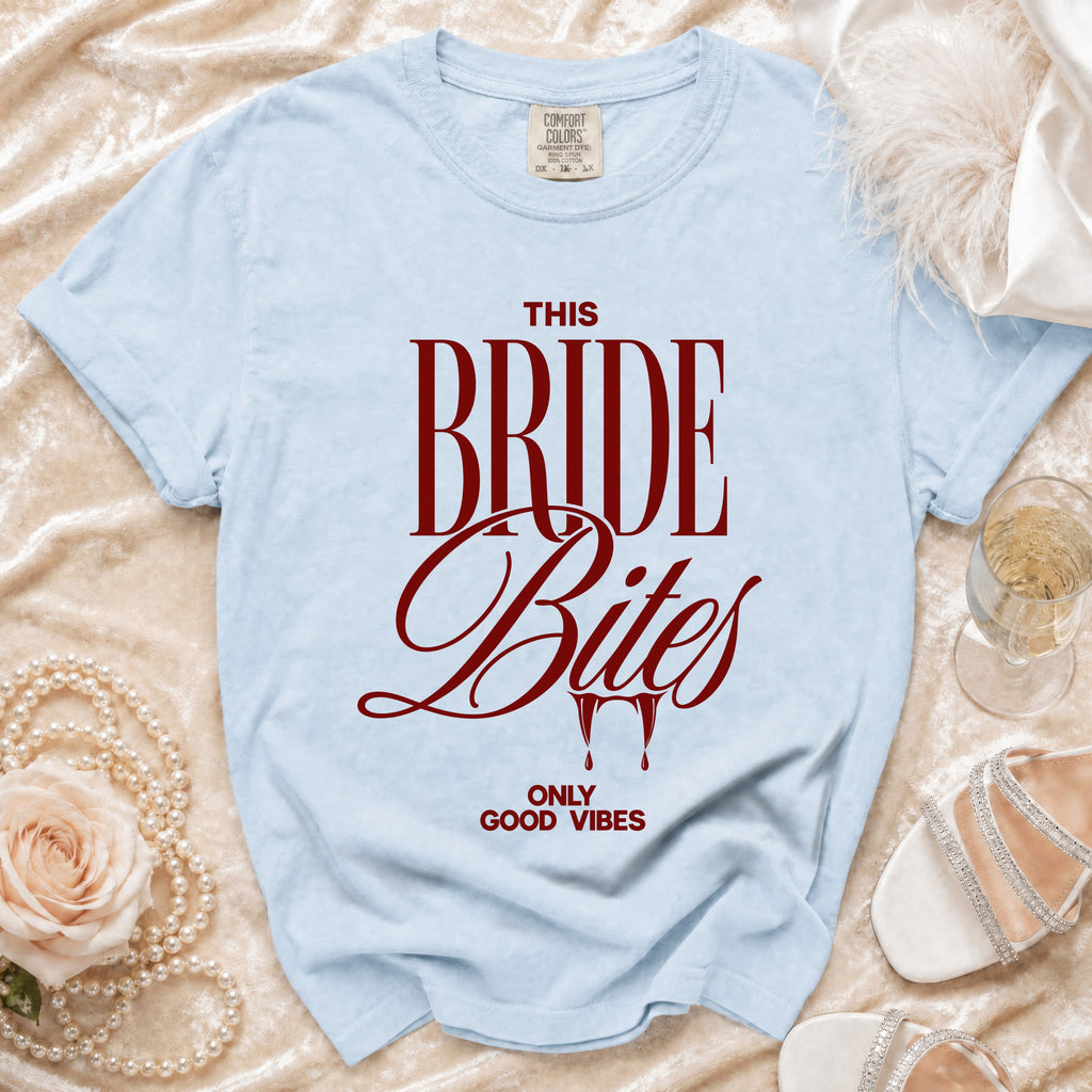 Light blue t-shirt with "THIS BRIDE Bites ONLY GOOD VIBES" in maroon text.