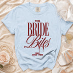 Light blue t-shirt with "THIS BRIDE Bites ONLY GOOD VIBES" in maroon text.