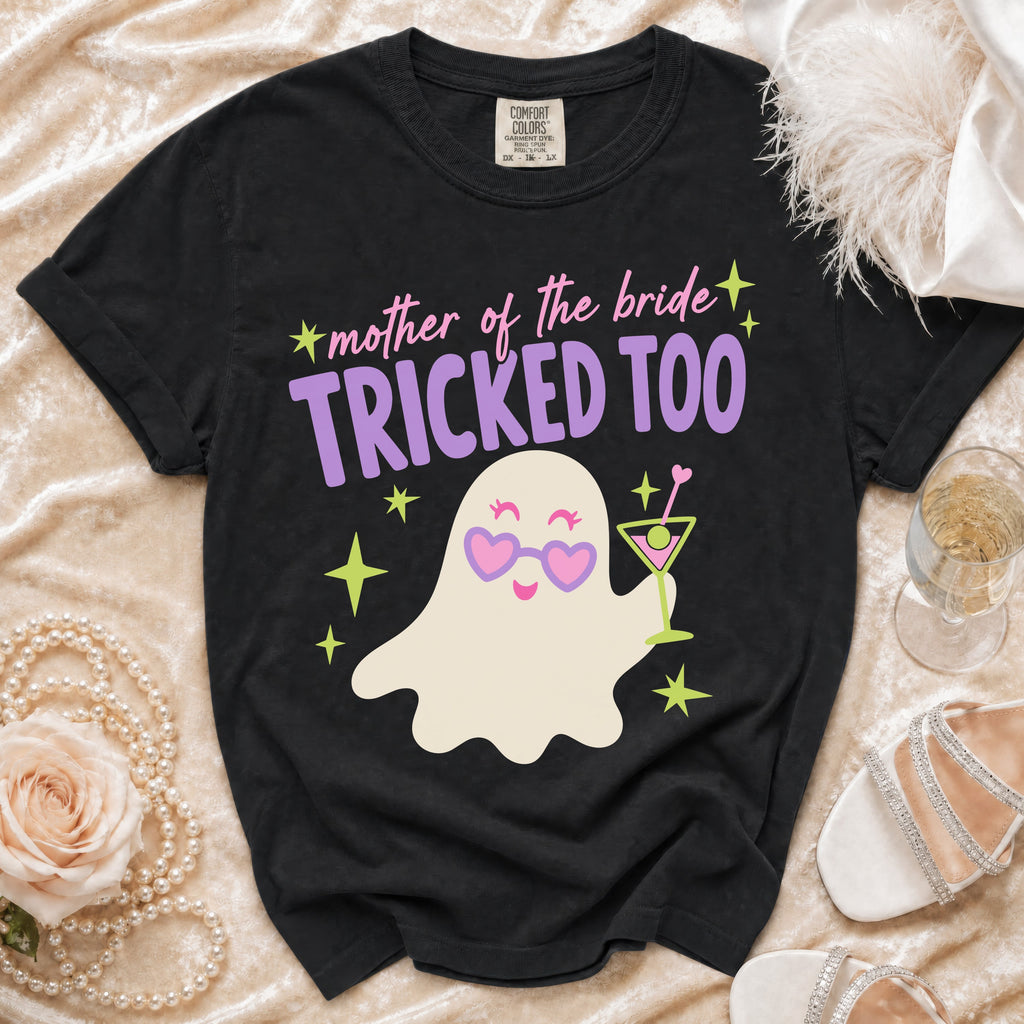 Black t-shirt with a ghost graphic and "mother of the bride TRICKED TOO" text.