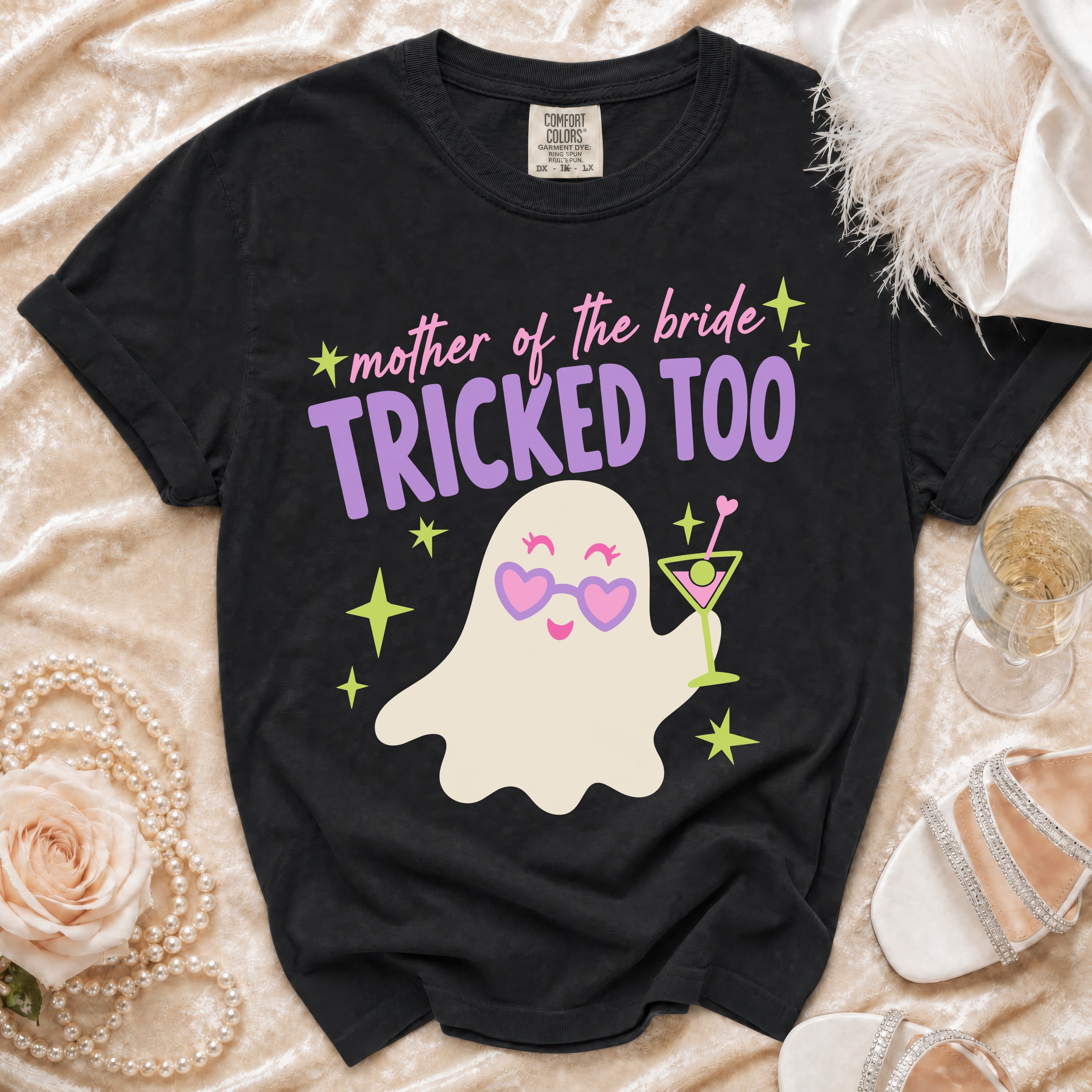 Black t-shirt with a ghost graphic and "mother of the bride TRICKED TOO" text.