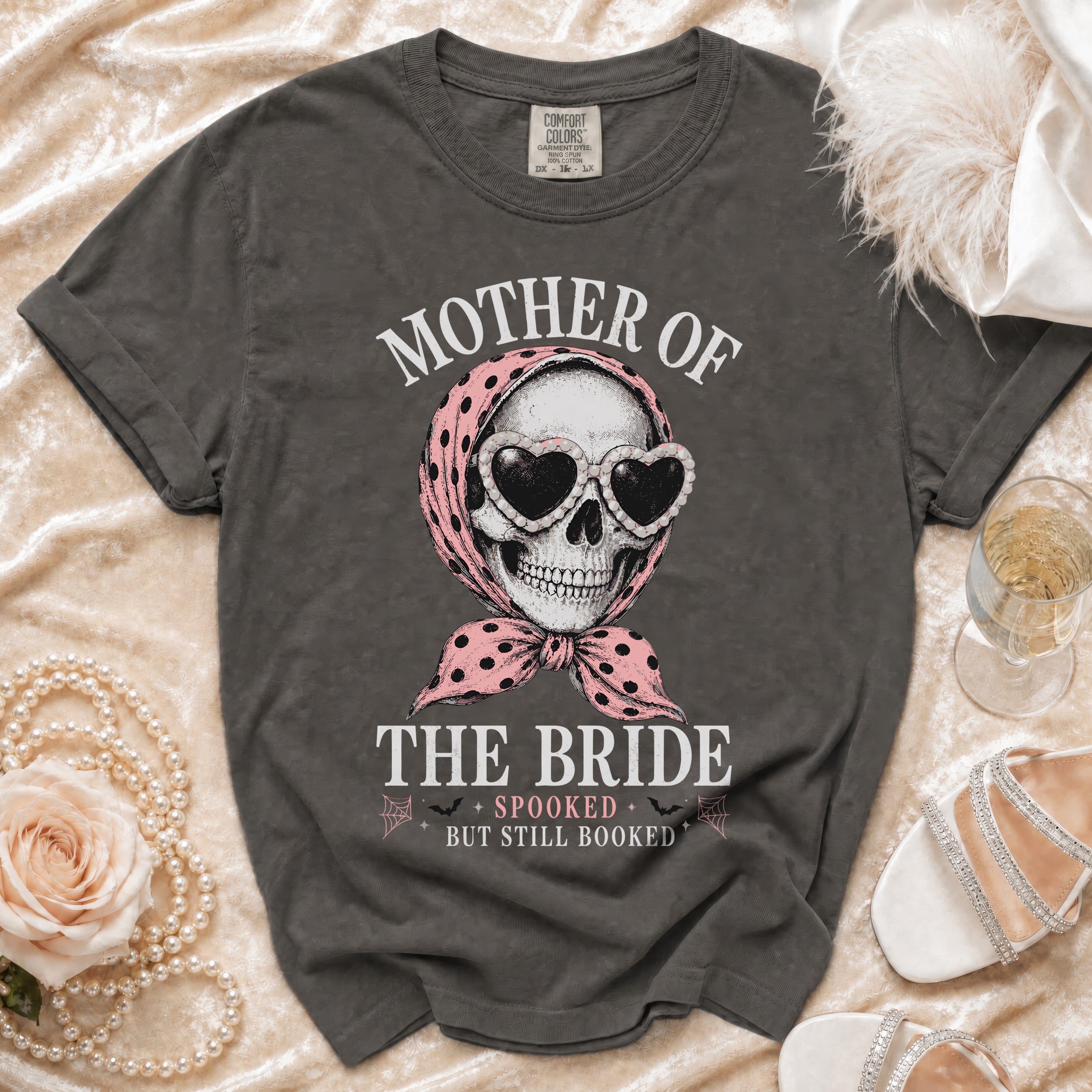 Dark grey t-shirt with "Mother of the Bride, Spooked but Still Booked" text and skull graphic.
