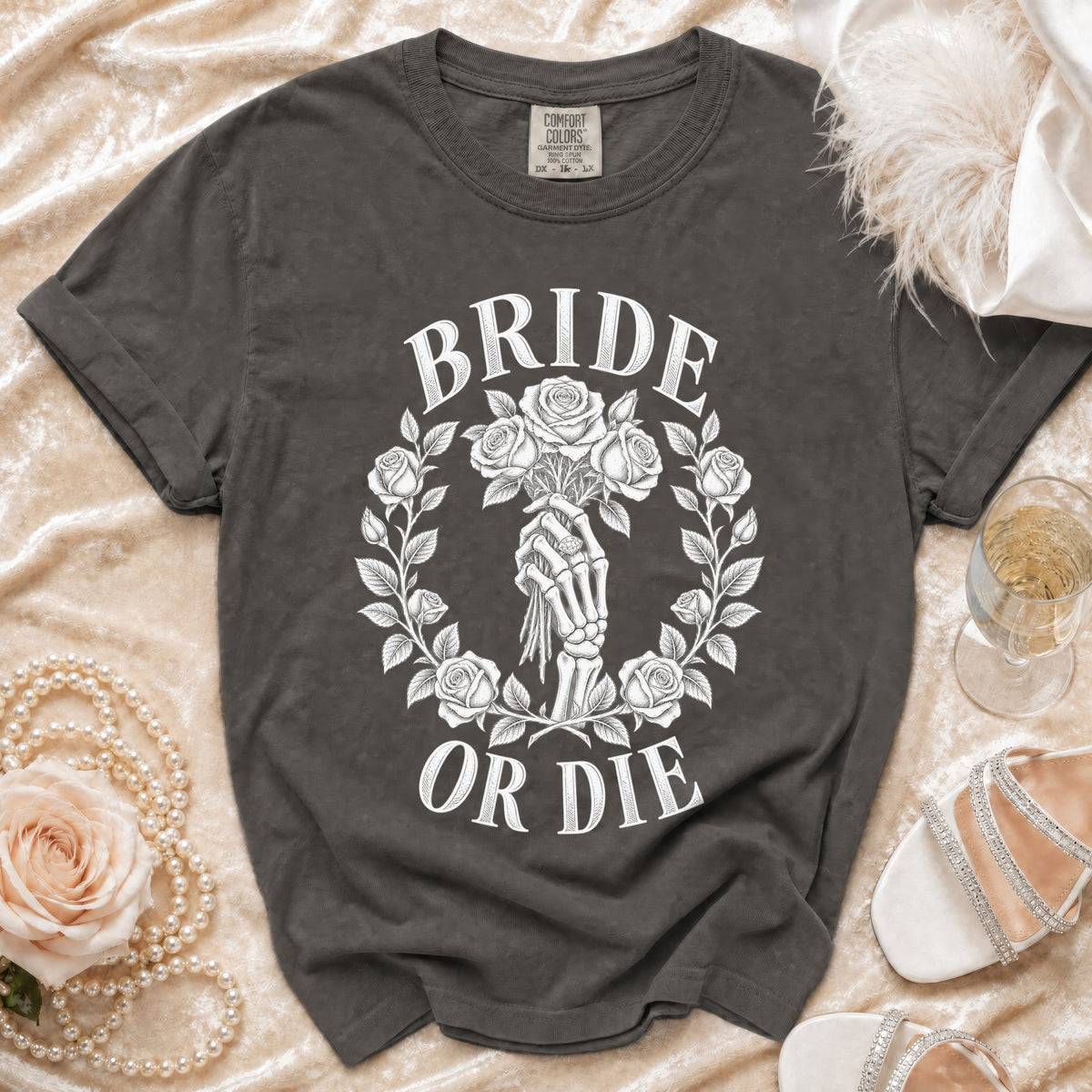 Dark grey t-shirt with white "Bride Or Die" text and skeleton hand holding roses.