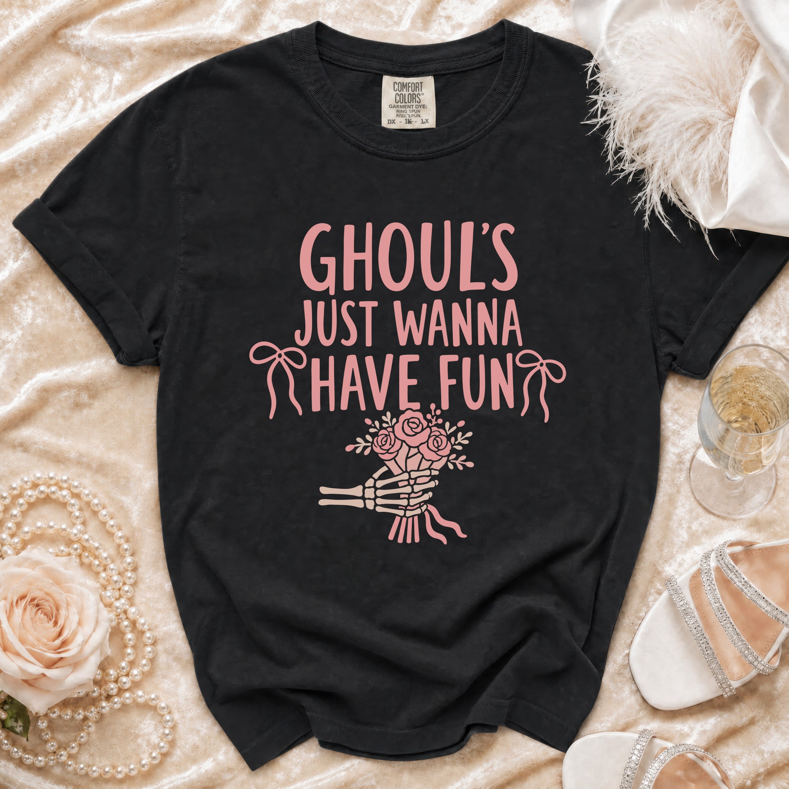 Black t-shirt with pink "Ghoul's Just Wanna Have Fun" text and skeleton hand bouquet.