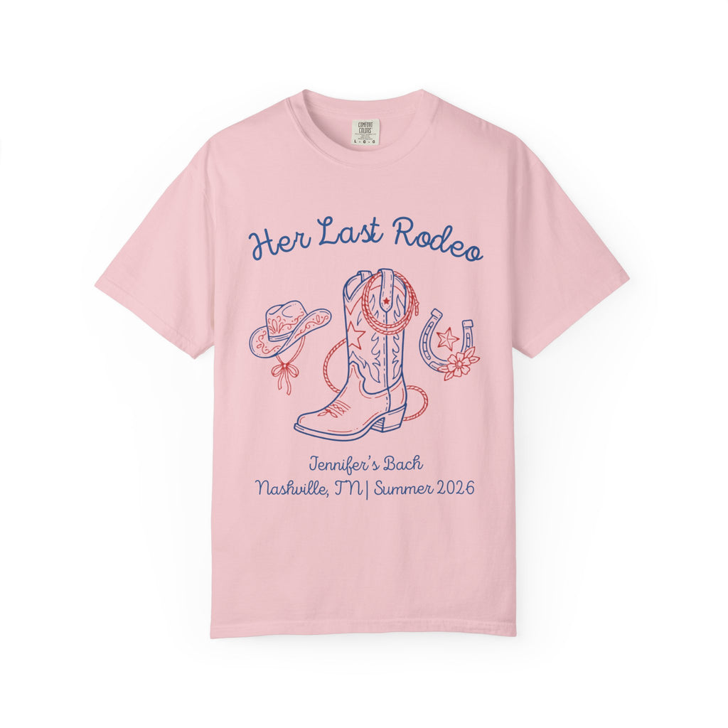 "Her Last Rodeo" graphic on pink t-shirt with cowboy boot, hat, horseshoe, and text.