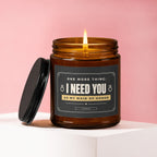 Amber candle with lid off, lit wick, "I NEED YOU AS MY MAID OF HONOR" text.