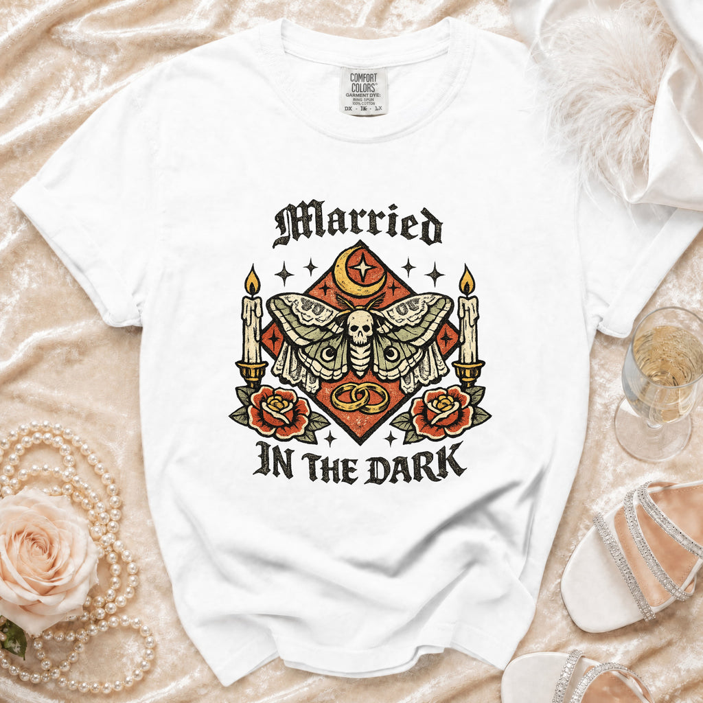 White t-shirt with "Married in the Dark" gothic moth graphic and ornate details.
