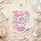 Cream t-shirt with "Maid of Honor Professional Bride Wrangler" graphic.