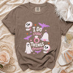 Brown t-shirt with "I DO crew THINGS forever" graphic featuring ghosts, skulls, bats, and wedding ring.
