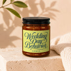 Amber jar candle with black lid and "Wedding Day Behavior VOWED" label.