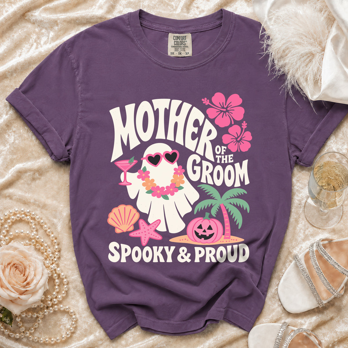 Purple t-shirt with "Mother of the Groom" ghost graphic and "Spooky & Proud" text.