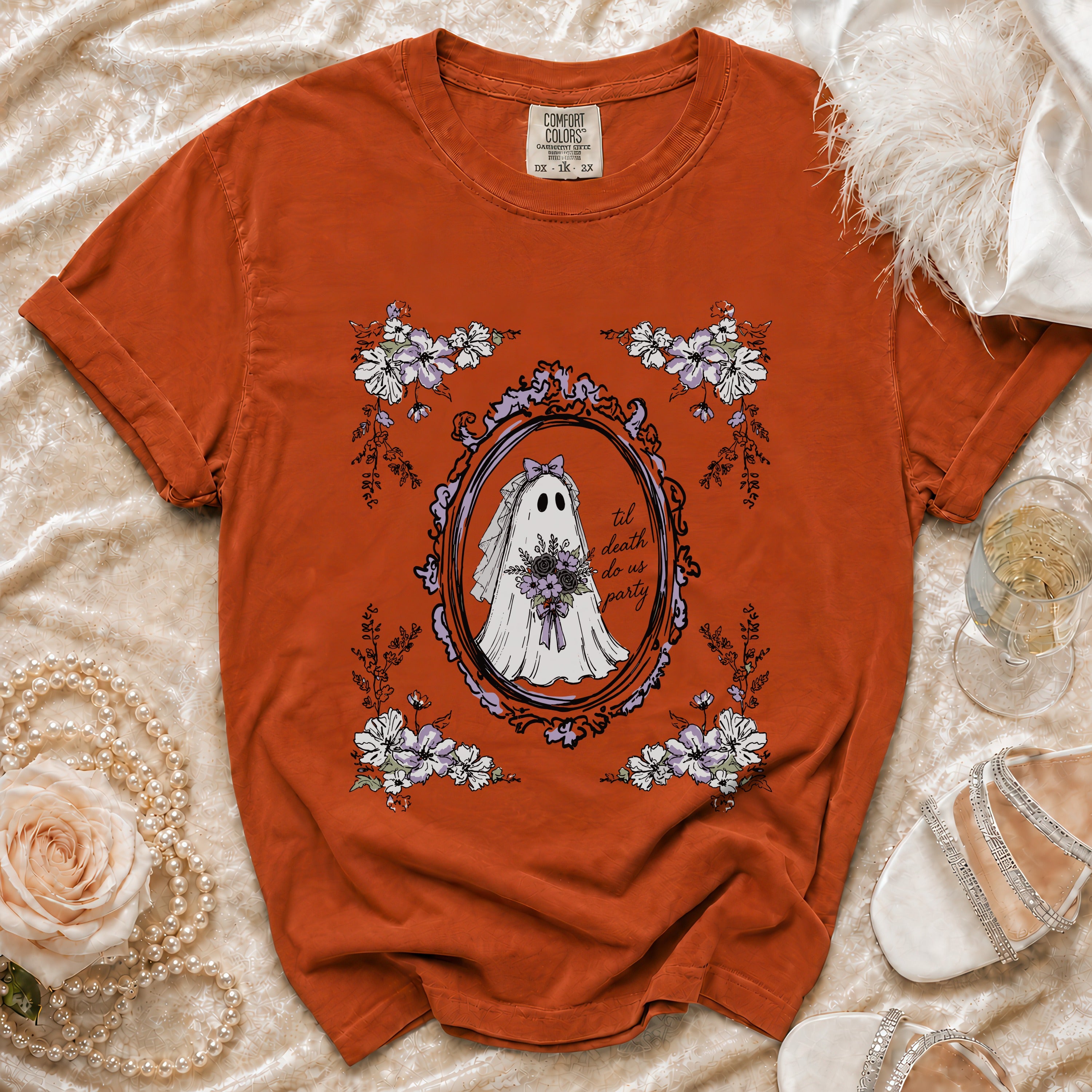 Orange t-shirt with a ghost bride design and text "til death do us party".