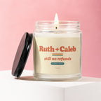 Glass candle with "Ruth + Caleb still no refunds SINCE 2009" on label.