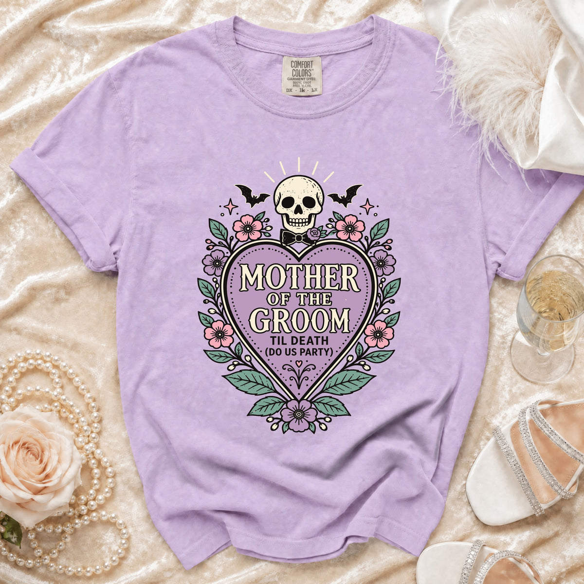 Lavender t-shirt with "Mother of the Groom Til Death (Do Us Party)" skull graphic.
