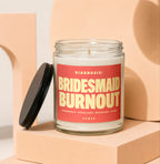Candle with red label that reads "DIAGNOSIS: BRIDESMAID BURNOUT. PROGNOSIS: EXCELLENT. RECOVERY: SLOW. VOWED"