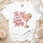 White t-shirt with "This Girl Needs a Spicy Marg" and margarita graphic.