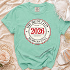 Aqua t-shirt with "The Bride Club Est. 2026 Members Only" graphic.