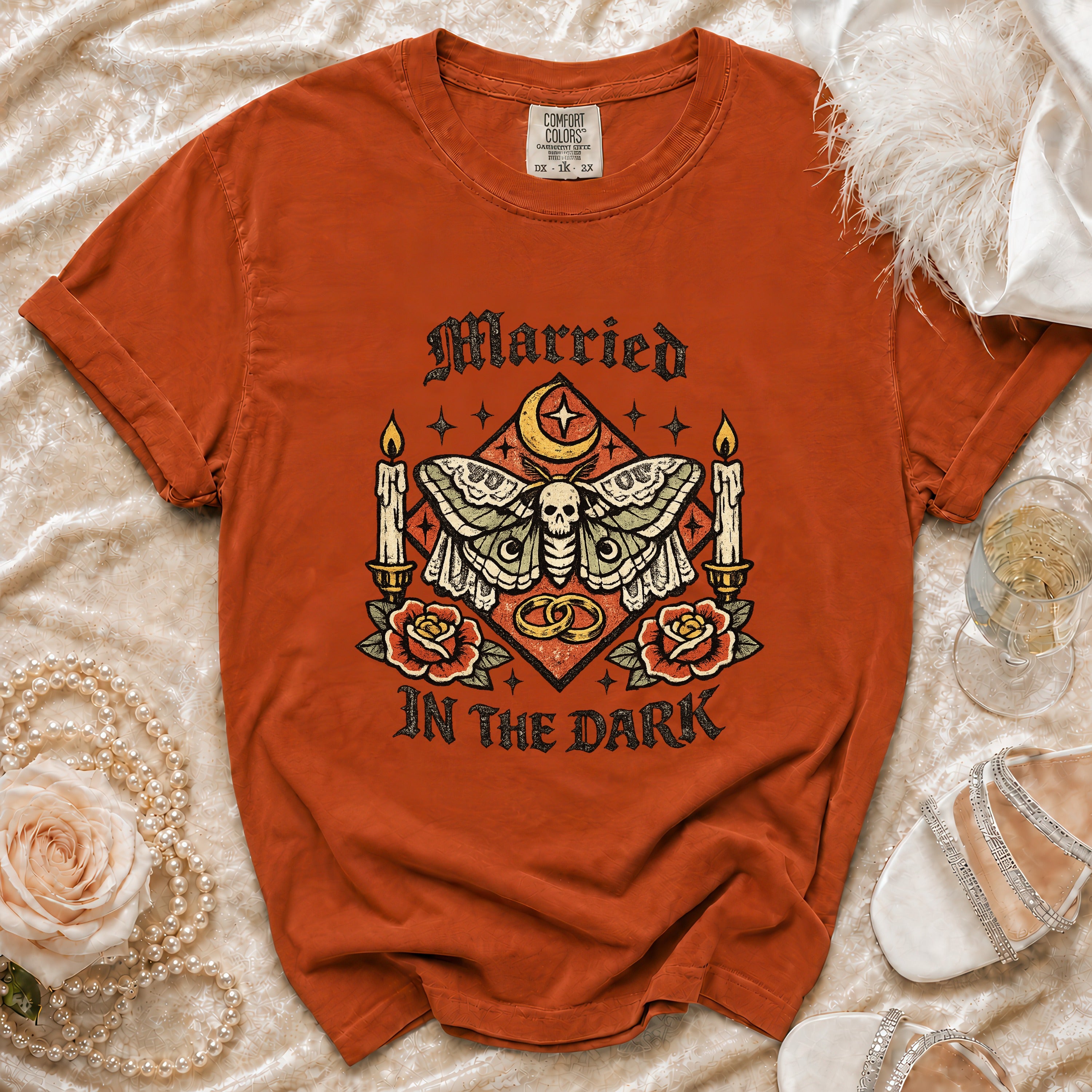 Orange Comfort Colors t-shirt with moth, skull, rings, candles, roses, and text "Married In The Dark".