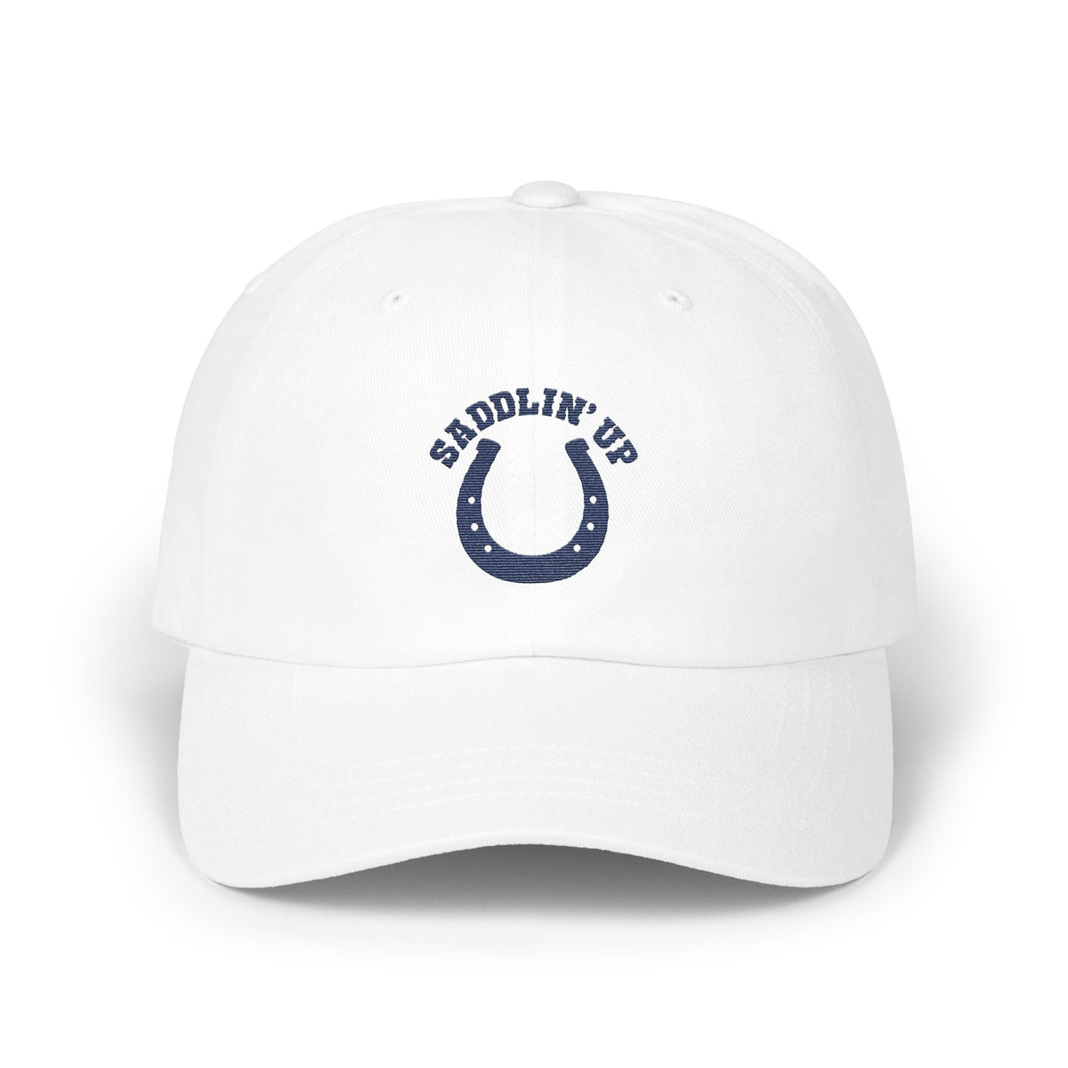 A white baseball cap featuring a blue horseshoe and the text SADDLIN UP on the front.