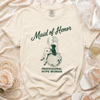T-shirt with "Maid of Honor Professional Hype Woman" text and retro illustration.