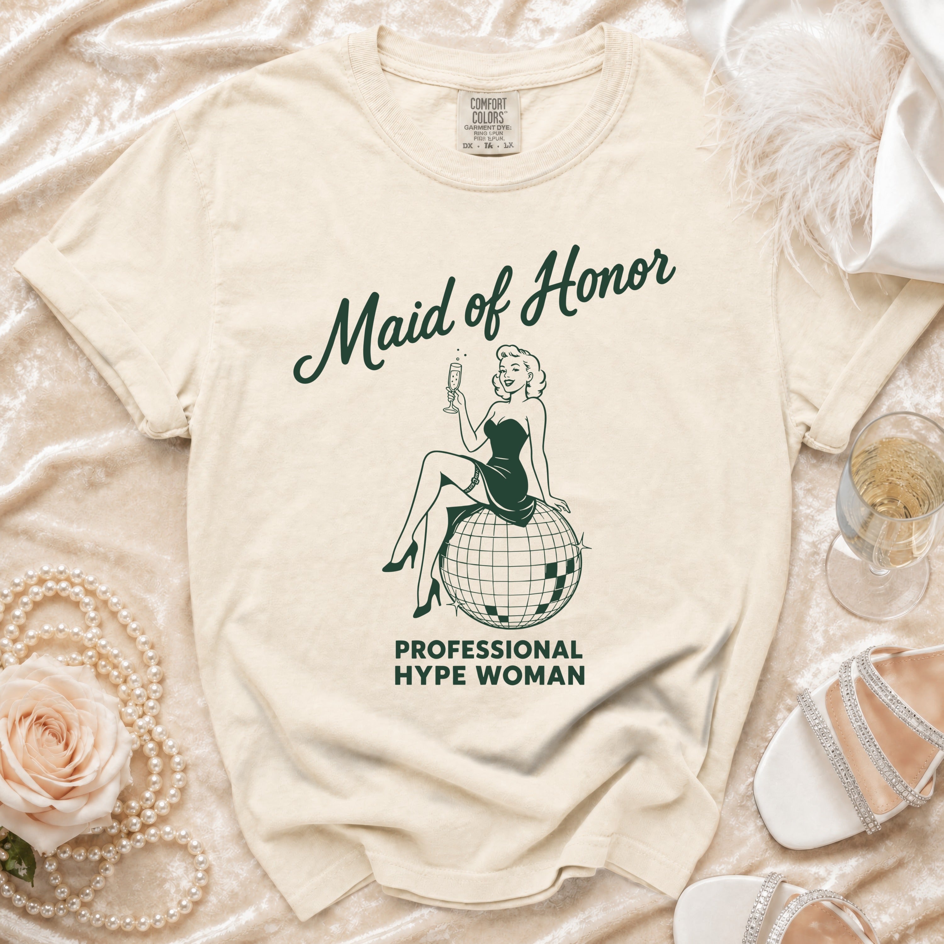 T-shirt with "Maid of Honor Professional Hype Woman" text and retro illustration.