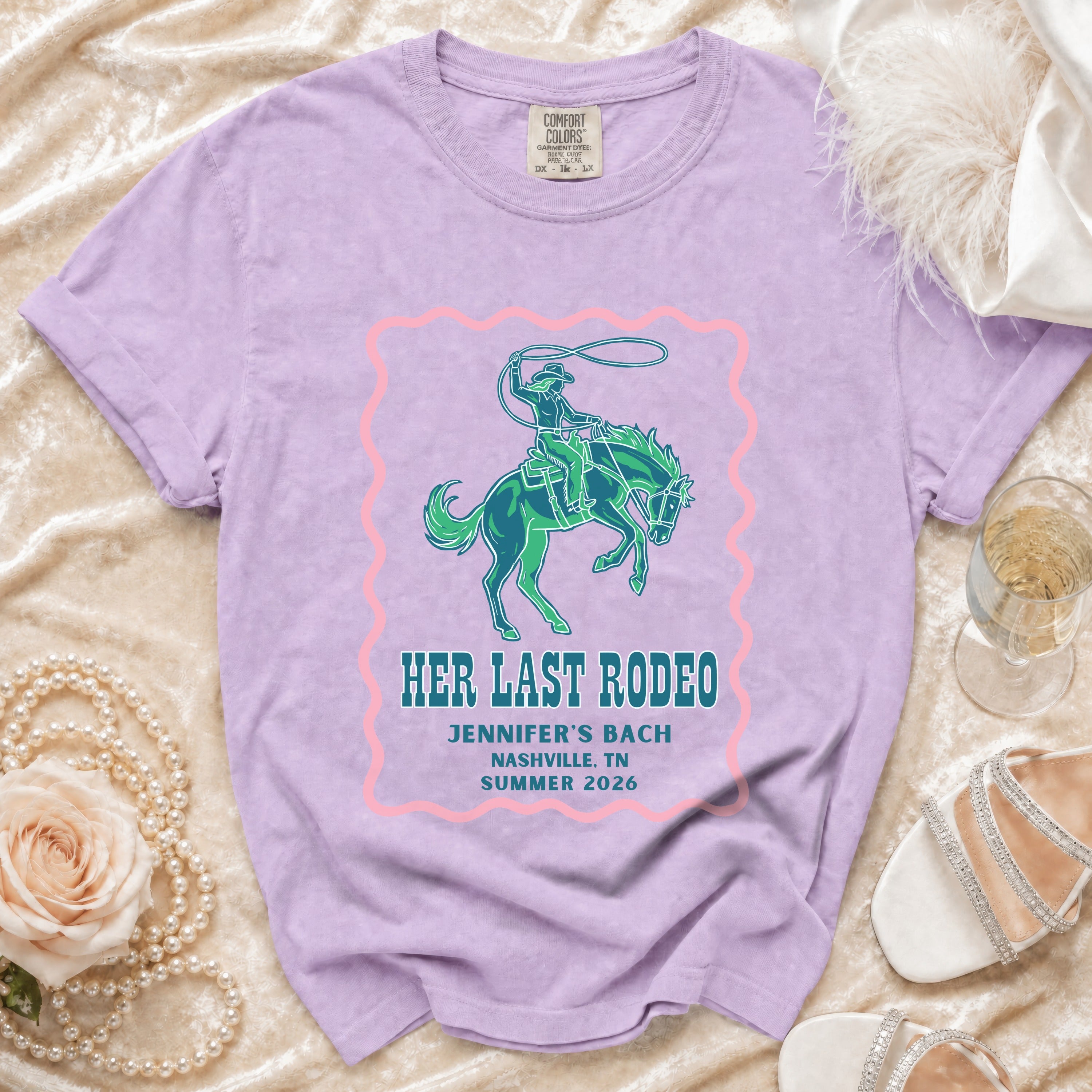 Purple t-shirt with "Her Last Rodeo" text and rodeo graphic.