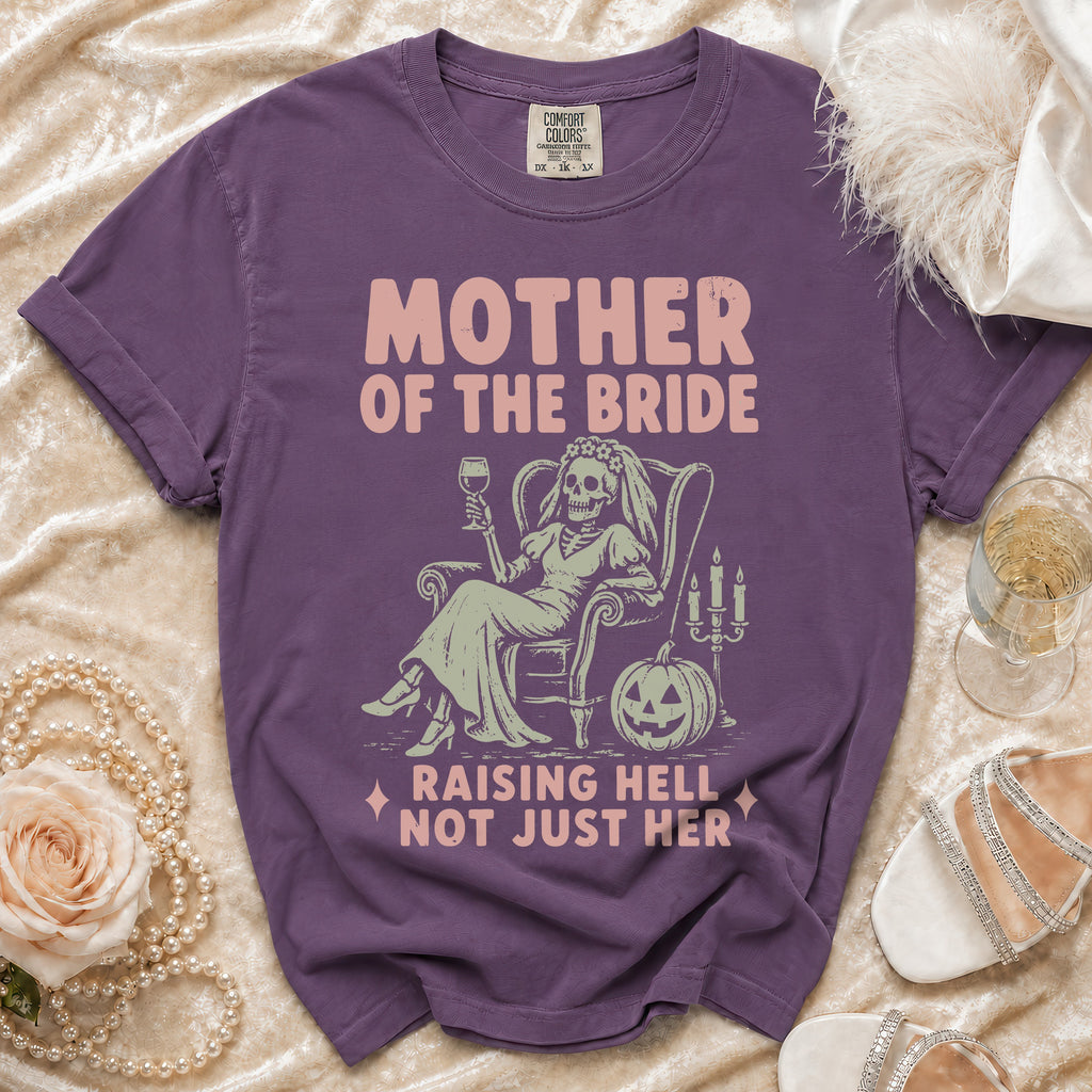 Purple t-shirt with "Mother of the Bride Raising Hell Not Just Her" graphic.