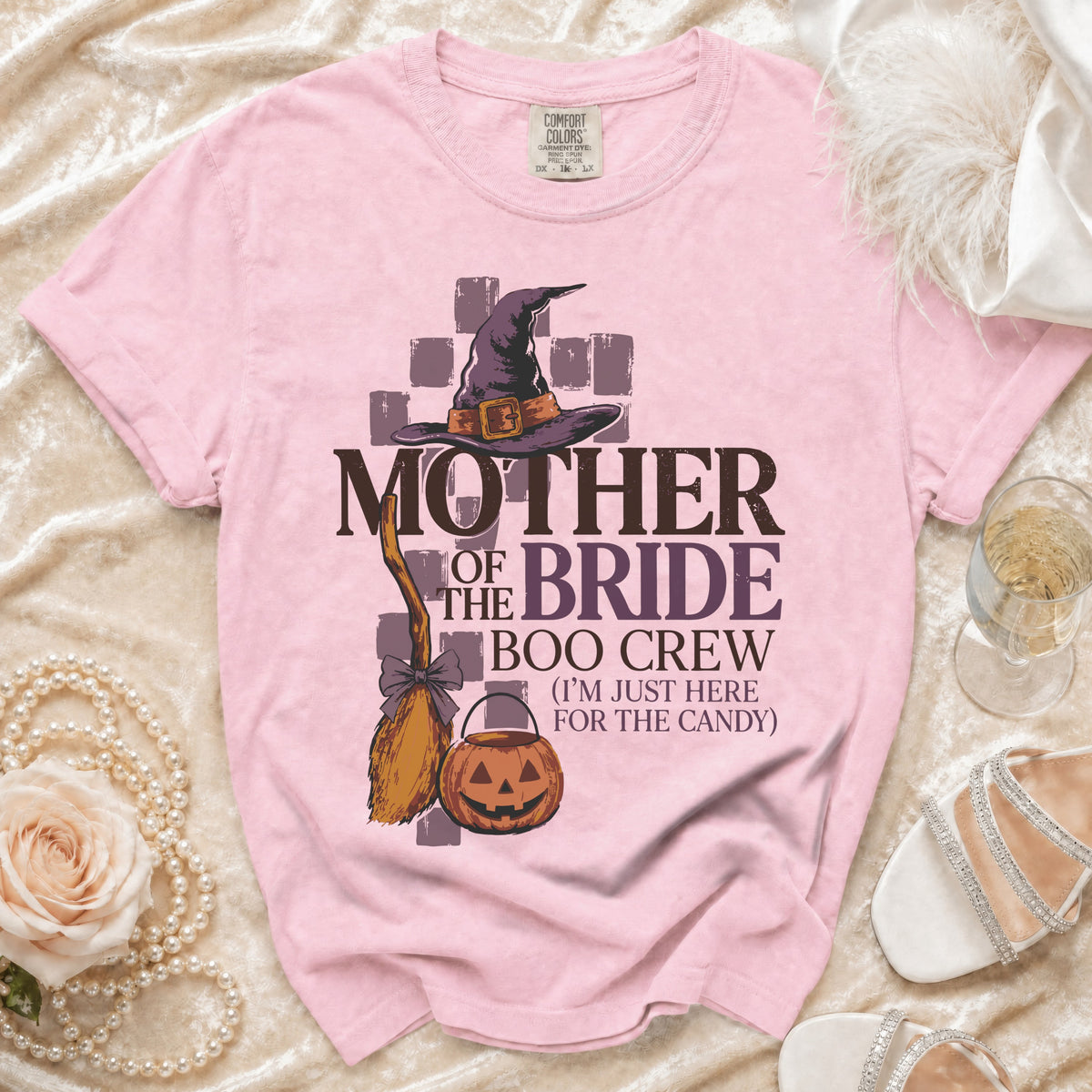 Pink t-shirt with "Mother of the Bride Boo Crew" Halloween graphic.
