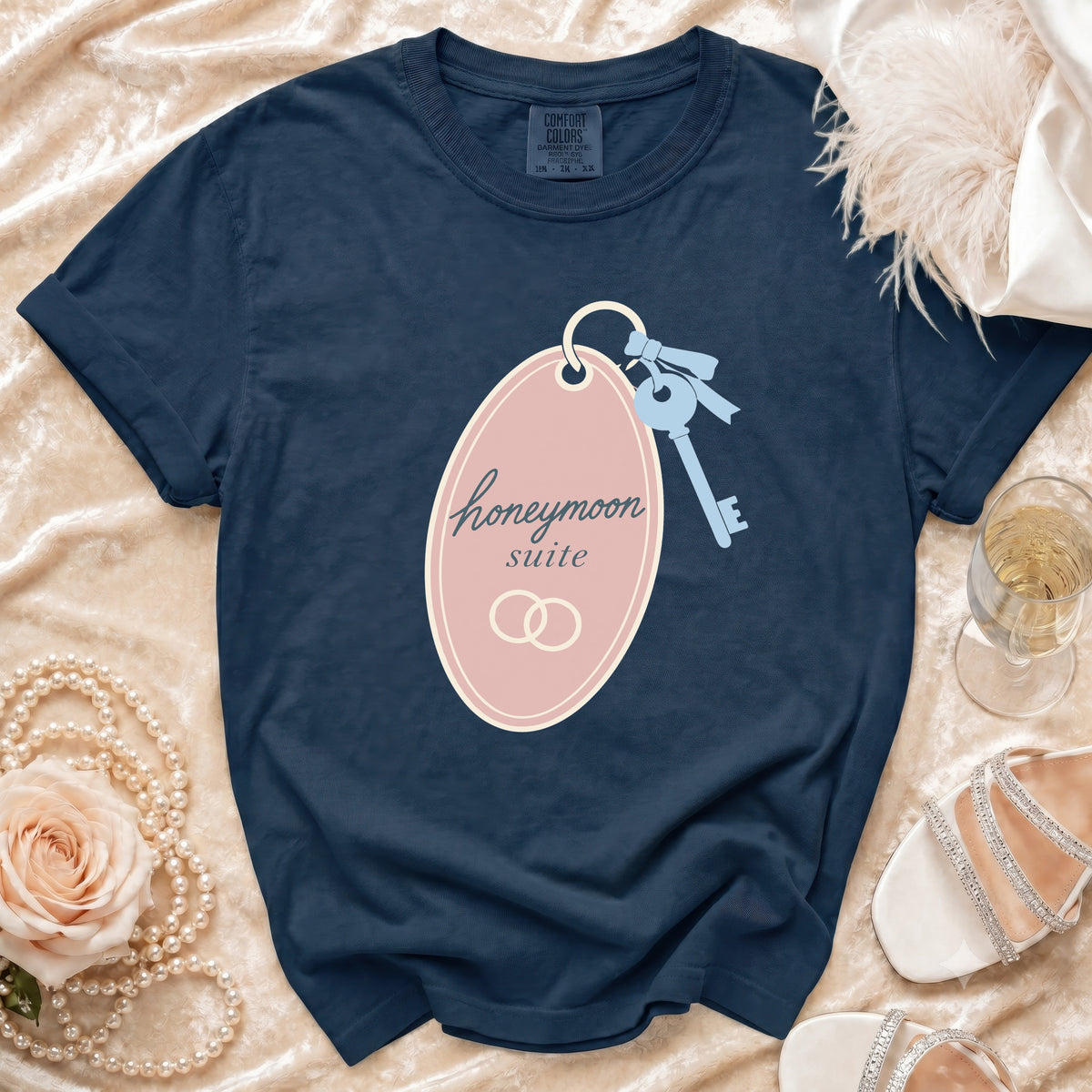 Navy t-shirt with "honeymoon suite" text and wedding rings graphic.