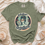 Green t-shirt with "Veiled Unbothered" graphic featuring a bride holding a drink.