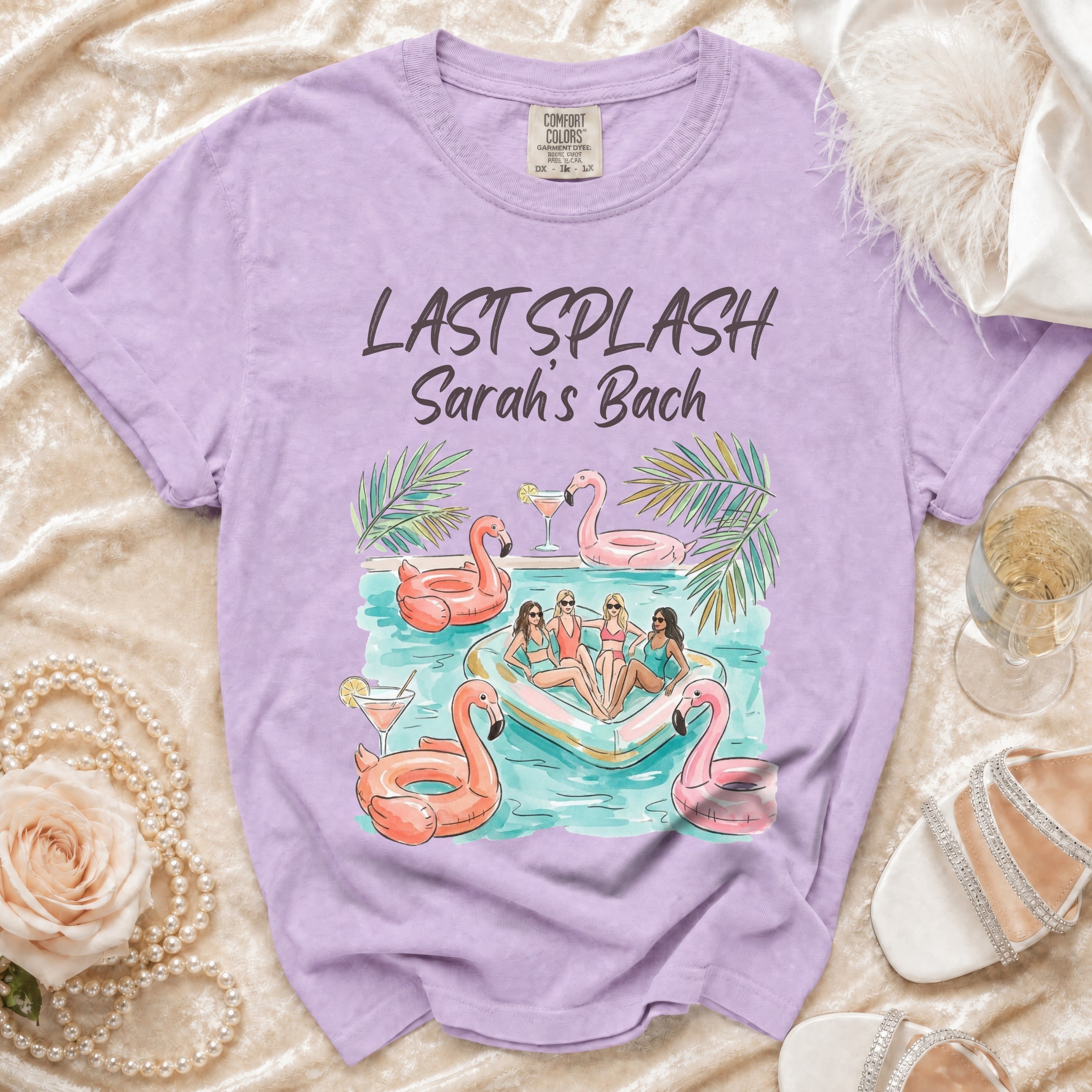 Purple t-shirt with "Last Splash Sarah's Bach" and girls on a pool float.