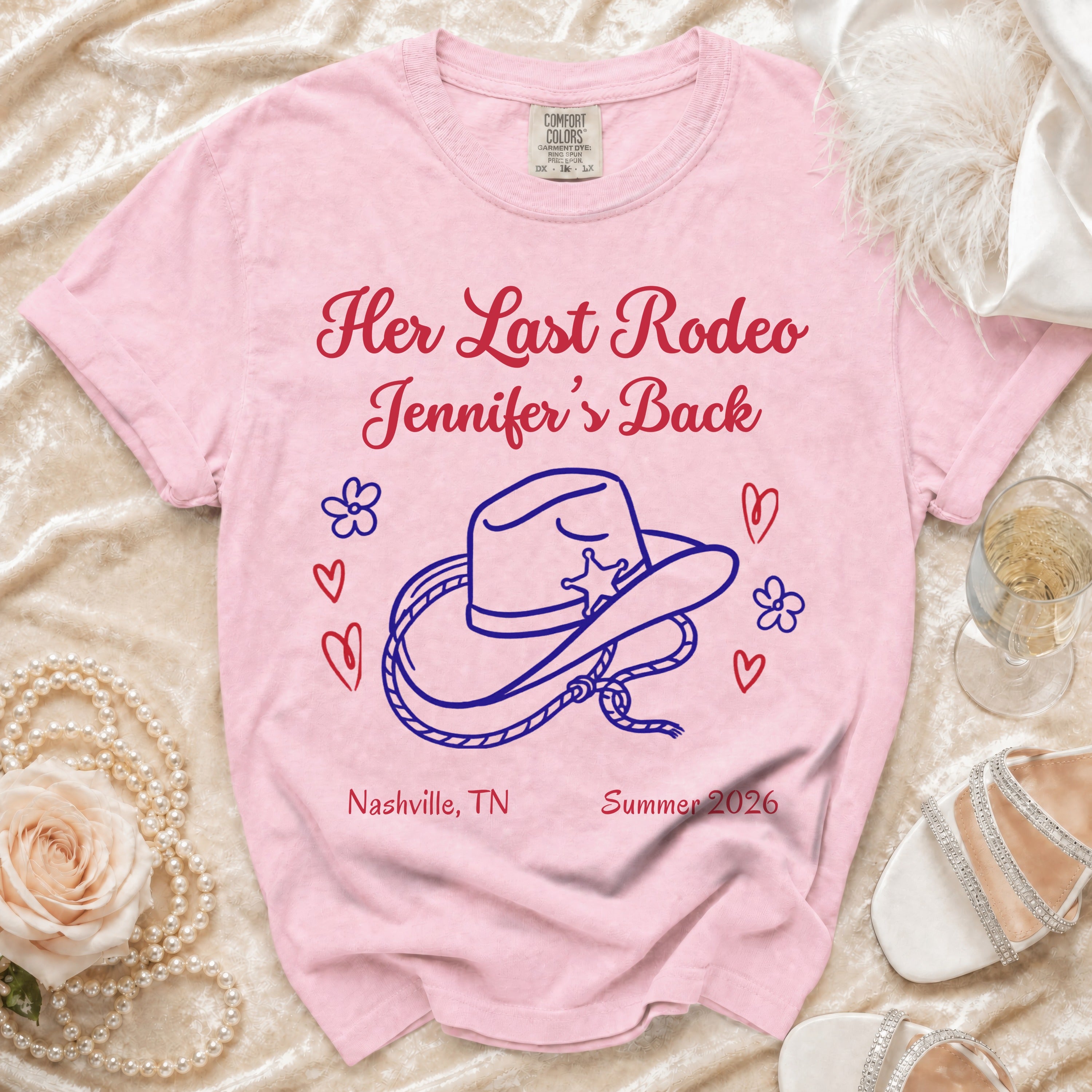 Pink t-shirt with "Her Last Rodeo" text, cowboy hat, and "Nashville, TN Summer 2026".