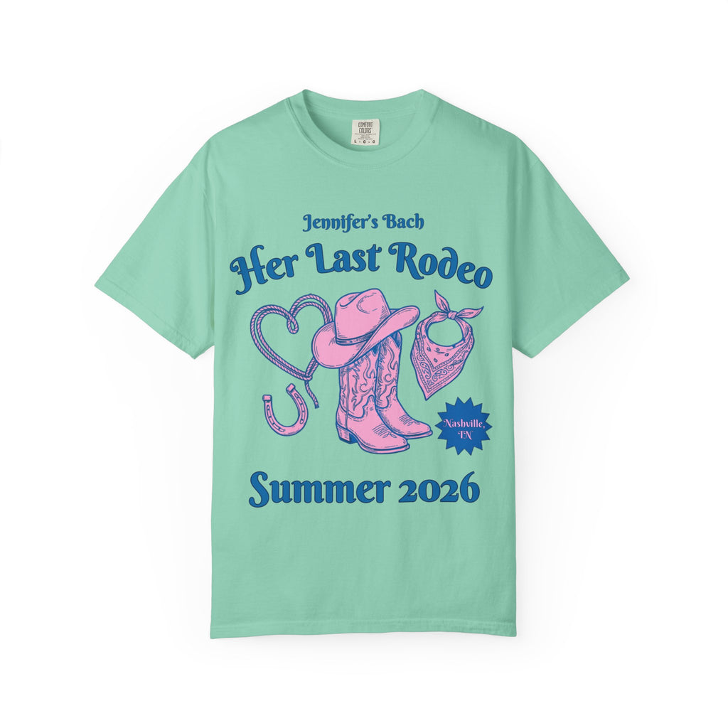 Teal t-shirt for "Jennifer's Bach: Her Last Rodeo" with cowboy boots, hat, and bandana.