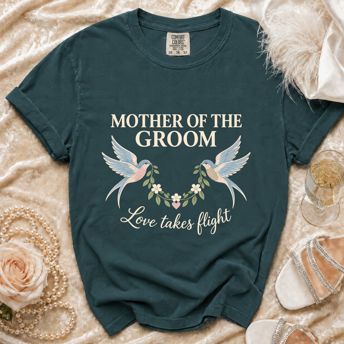 "Mother of the Groom" t-shirt with birds, wreath, and "Love takes flight" text.