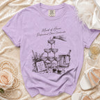 Purple t-shirt with sketch of champagne tower, "Maid of Honor. Professional Chaos Coordinator." text.